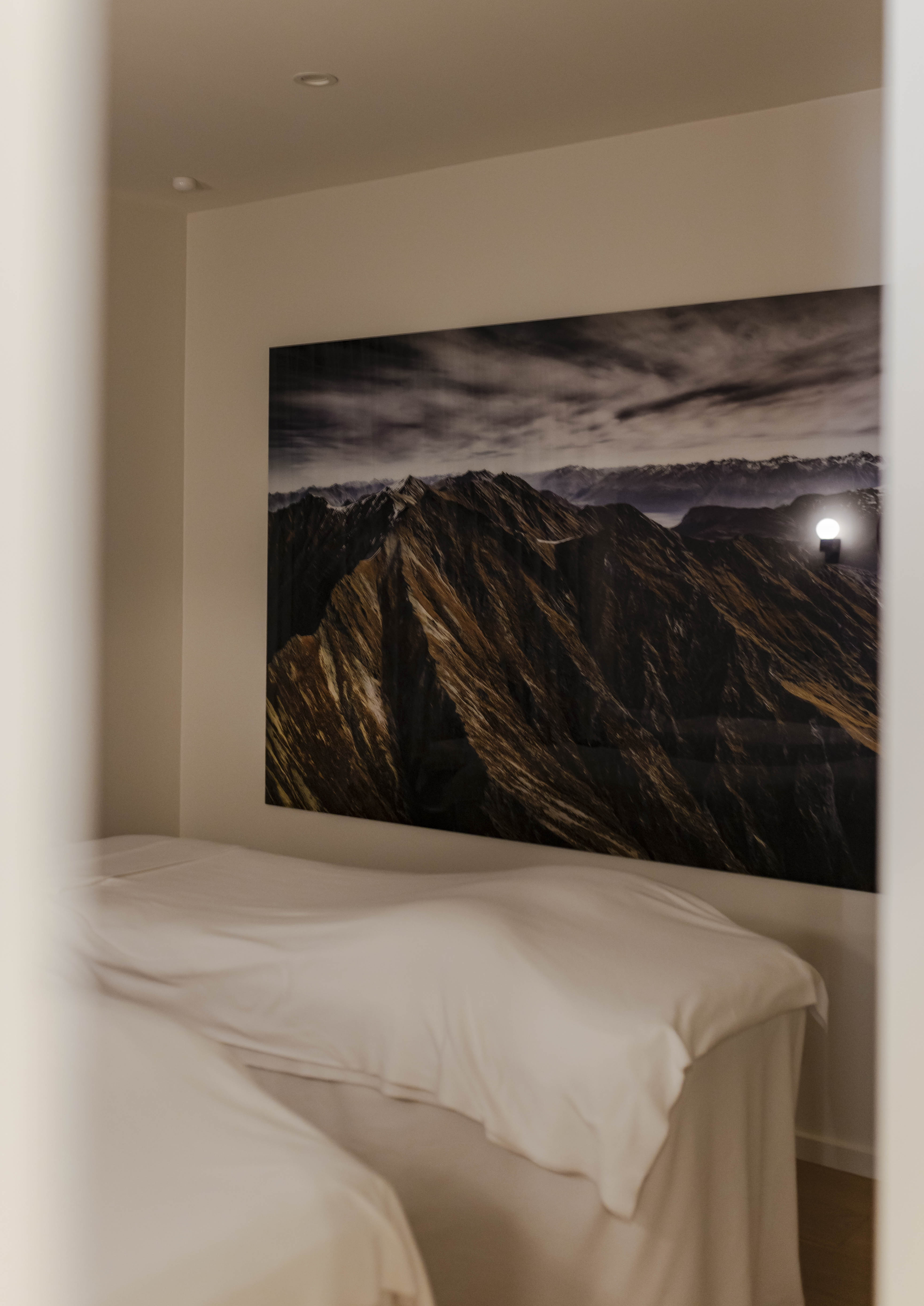 A treatment room at The Well Spa with Southern Alps artwork